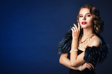 Woman Retro Beauty Portrait, Fashion Model Old Fashioned Hairstyle and Make Up, Studio Shot on Blue...