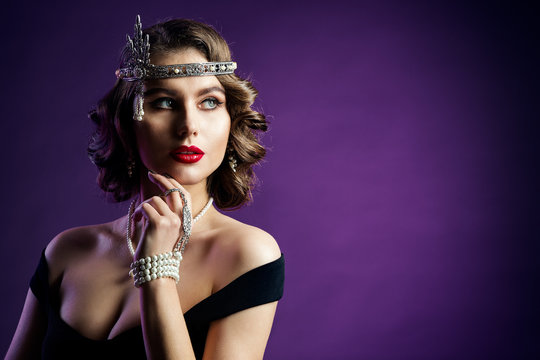 Retro Beauty Portrait, Woman Old Fashion Hairstyle And Make Up, Studio Shot On Purple Background