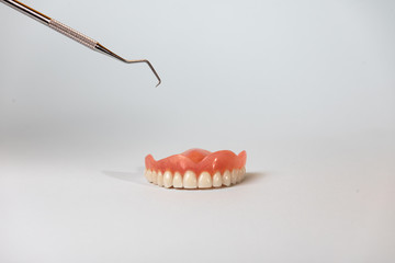white-toothed denture and dentist material