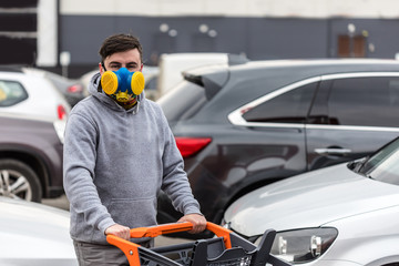 Man wearing face mask, going for shopping at epidemic coronavirus time.