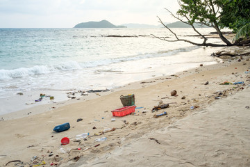 Spilled plastic on the beach. Ecological problem concept