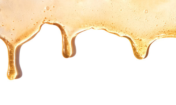Flow of sweet honey on the white background