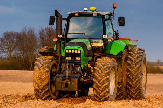DEUTZ-FAHR agricultural tractor in the spring field during fertilizing with .Szczecin,Poland-March 2020.