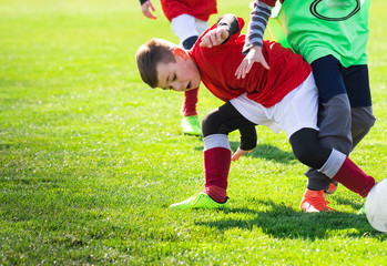Boys play soccer sports field