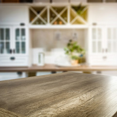 Desk of free space for your decoration and blurred kitchen interior.