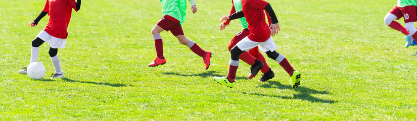 Boys play soccer sports field