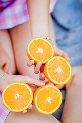 woman holding orange in her hands