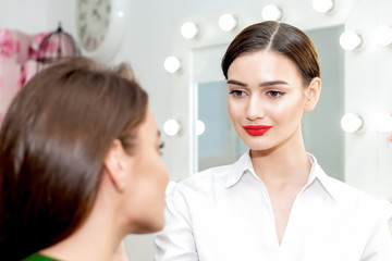 Makeup artist doing make up.