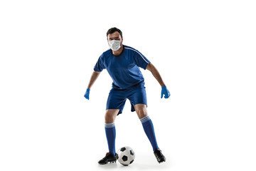 Beat the disease. Male football, soccer player in protective mask. Prevention against pneumonia. Still active while quarantine. Chinese coronavirus treatment. Healthcare, medicine, sport concept.