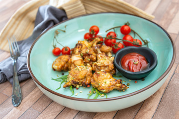 delicious fried chicken wings with sauce