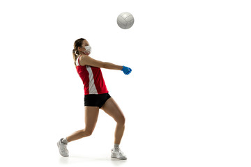 Beat the disease. Female volleyball player in protective mask. Prevention against pneumonia. Still active while quarantine. Chinese coronavirus treatment. Healthcare, medicine, sport concept.