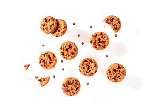 Chocolate chip cookies, flying on a white background, shot from the top
