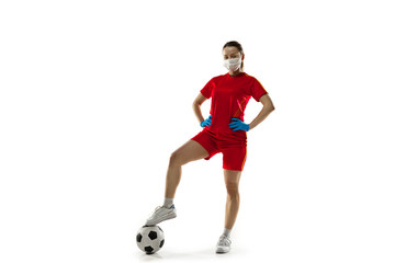 Beat the disease. Female football, soccer player in protective mask. Prevention against pneumonia. Still active while quarantine. Chinese coronavirus treatment. Healthcare, medicine, sport concept.
