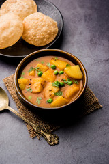 Aloo Puri or Potato curry with fried Poori, popular Indian breakfast / lunch / dinner menu.