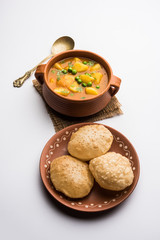 Aloo Puri or Potato curry with fried Poori, popular Indian breakfast / lunch / dinner menu.