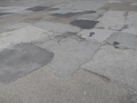 patchwork or hotchpotch of fifty shades of gray asphalt
