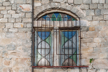 stained glass window in an old stone house