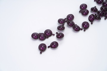 Purple water drop shape fragrance in the white background, it has charming fragrance and is used as fragrance, which can be carried with you. Successful people and women like it very much