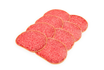 Salami slices isolated on white background.