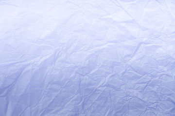 Texture of crumpled light blue wrapping paper, closeup. Lilac old background.
