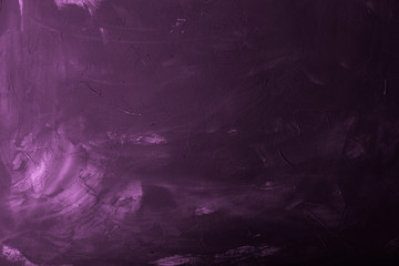 Textured plastered background with a variety of arbitrary stains. Violet