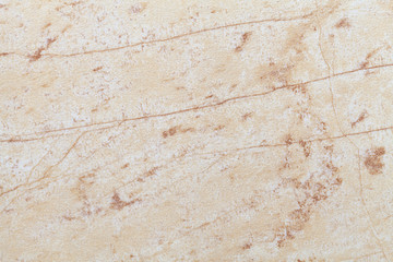 Texture of beige old marble material with cracked pattern, macro background.