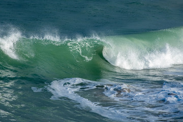 Fototapeta na wymiar Wave curling and breaking on Cornish coast