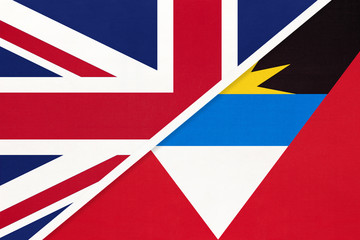 United Kingdom vs Antigua and Barbuda national flag from textile. Relationship between two countries.