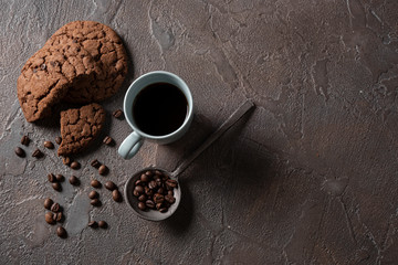 Top view cup of coffee with cookies