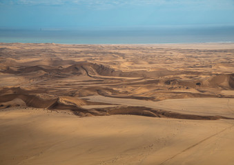 Aerial picture of the landscape of the Namib Desert and the Atlantic Ocean on the Skeleton Coast in western Namibia