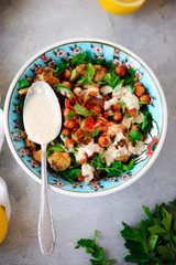 ROASTED CAULIFLOWER SALAD WITH LEMON TAHINI DRESSING..life style .selective focus
