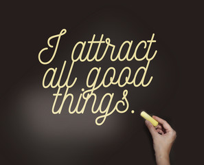 I Attract All Good Conceptual things words hand writing on black board. Positive attraction law...