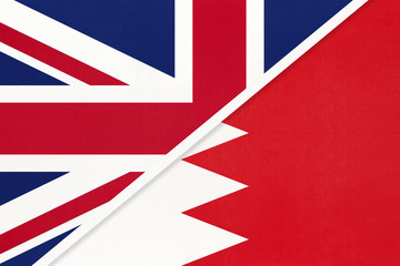 United Kingdom vs Bahrain national flag from textile. Relationship between two european and asian countries.