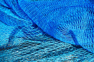 Commercial blue color fishing nets background. Top view