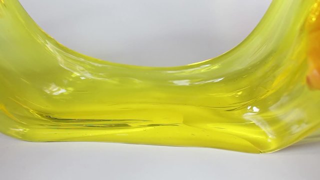 Playing with oddly satisfying slime, small figurines & stretching the gooey substance for pure fun and stress relief