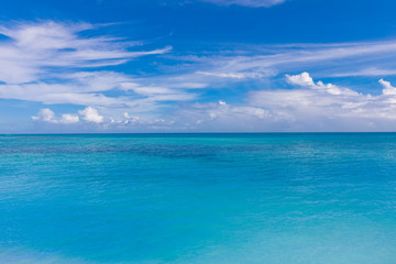 Fototapeta na wymiar Caribbean panorama Hawaiian Maldivian coast with a boat in a turquoise tropical sea