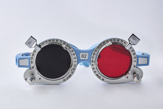 Optometrist tools with red filter on trial frame test, Equipment tool for test vision isolated on white background.