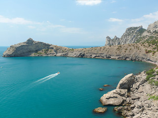 Crimea landscape with juniper trees rocks and sea