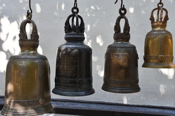 Fototapeta na wymiar Ceremonial Bells in Descending Size Order, Wat Phra That, Doi Suthep, Chiang Mai