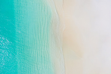 Summer seascape beautiful waves, blue sea water in sunny day. Top view from drone. Sea aerial view,...