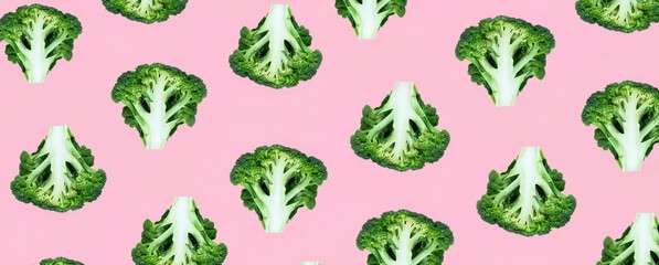 Seamless minimalistic pattern with broccoli on a pink background. Photo collage, vegan pop art design, veggies backdrop, diet, healthy food. Banner, Top view.