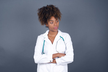 Closeup portrait displeased pissed off angry grumpy pessimistic doctor woman with bad attitude,...