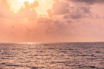 Fototapeta premium Beautiful sunset twilight over sea beach. dusk, sunrise, sunshine, wave, dawn, daylight, golden, horizon, light, ocean, orange, reflection, sun, sunset, beauty, bright, cloud, color, morning, sky