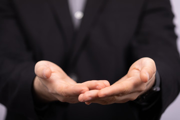 Businessman without head holding something without theme