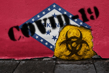 Flag of the state of Arkansas on the wall with covid-19 quarantine symbol on it. 2019 - 2020 Novel...