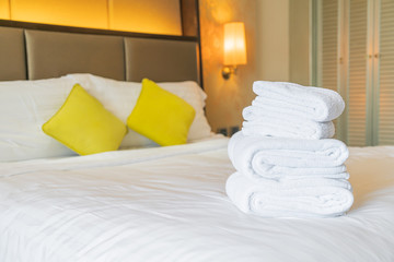 white towel fold on bed