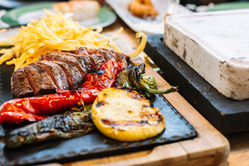 grilled vegetables and meat. Potatoes, peppers, barbecue steak. Healthy food close-up