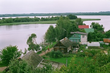 Film photography of landscape with river and houses