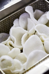 Frying of Healthy Gluten Free Rice Chips in a Pile