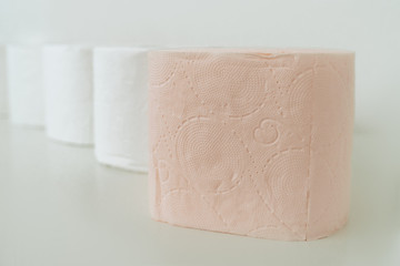 Rolls of toilet paper. A lot of toilet paper is standing nearby. Purchasing toilet paper